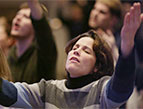 woman hands raised, praising god in worship and prayer